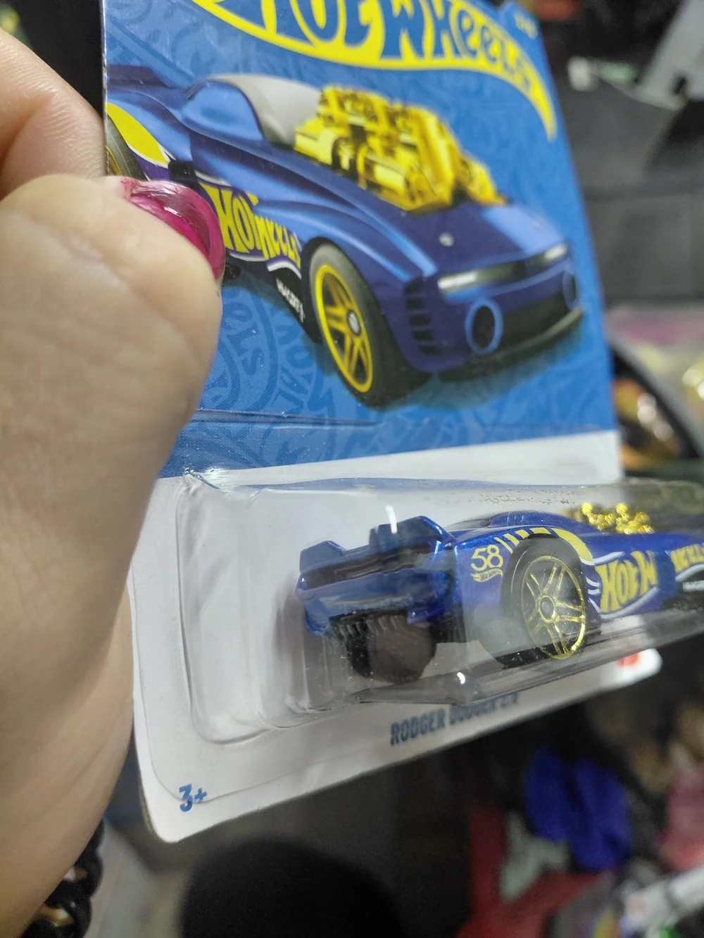 the Hot Wheels Rodger Dodger 2.0 from the 2026 58th Anniversary Blue and Gold se